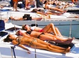 Sunbathing on board.